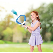 Child holding a blue soft racket with turquoise shuttlecock above ball