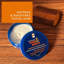 Blue beard leave-in conditioner jar with white cream; comb on wood background