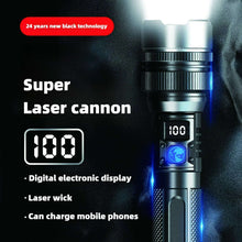 Handheld flashlight close-up with digital display and blue indicator light