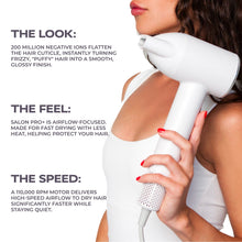 White hair dryer aimed at hair with concentrator nozzle