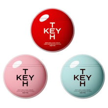 Three KEYTH perfumed hand cream lids: red, pink, and teal round tins