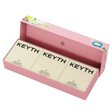 Open pink KEYTH hand cream trio box with three labeled cream tins