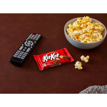 KIT KAT milk chocolate wafer candy bar in red wrapper with chocolate pieces
