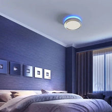 Round LED ceiling light with blue ambient ring in bedroom
