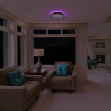 Round LED ceiling light with soft purple glow in living area