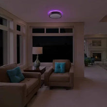 Round LED ceiling light fixture with purple ambient glow