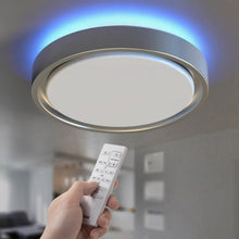 Round LED ceiling light with blue glowing ring and remote control