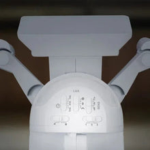 White LED motion security light with motion sensor dial and control icons on head