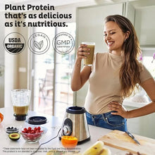 Woman holding a blended plant protein drink with KOS powder and blender setup