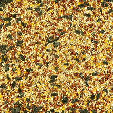 Mixed wild bird seed blend with small grains and leafy pieces