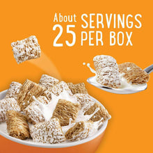 Plate of frosted wheat breakfast cereal pieces with milk splash.