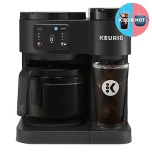 Black Keurig dual coffee maker with carafe and mug under spout