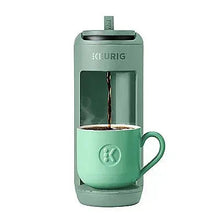 Keurig K-Mini Mate pod coffee maker in Glamping Green with cup under brew spout