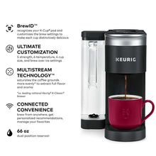 Single-serve pod coffee maker with red mug and side feature text