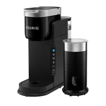 Black coffee maker with frother cup and side control panel.