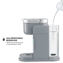Gray single-serve coffee maker with removable water reservoir and iced drink