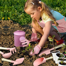 Kids gardening tool set with pink watering can, trowel, small hand tools and gloves