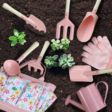Kids gardening tool set with pastel pink tools, wooden handles, watering can and scoop