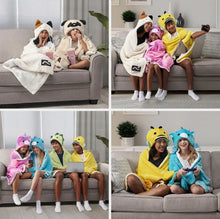 Kids hooded throw shown on a sofa with matching animal-hood capes