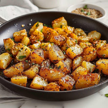 Skillet of buttery garlic & herb-seasoned potatoes with herbs and spices