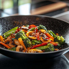 Skillet of grilled vegetables with seasoning sauce and herbs
