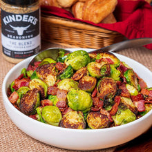 Kinder's The Blend seasoning salt jar beside bowl of roasted Brussels sprouts