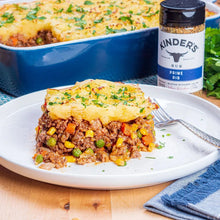 Prepared beef dish with rice and vegetables, plus Kinder's Prime Rib Rub jar bottle.