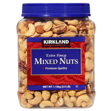 Extra fancy mixed nuts jar with blue lid and red label, whole nuts visible in glass