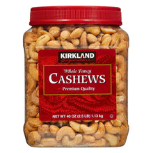 Whole fancy cashews in clear jar with red lid