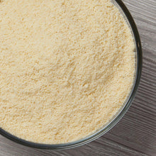Blanched almond flour in a round metal bowl