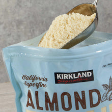 Kirkland Signature almond flour bag with scoop of ground flour