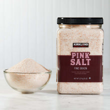 Pink salt jar with fine grain, with bowl of pink salt beside it