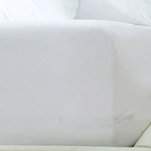 White fitted sheet corner with elastic edge detail