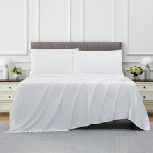 White sheet set with pillowcases, neatly laid on a bed