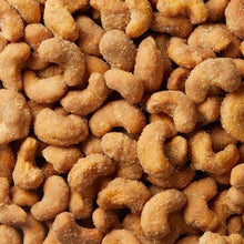 Golden-brown sugar-coated cashew pieces, close-up texture