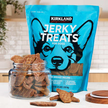 Chicken jerky dog treats pouch with Kirkland logo, with jerky pieces in a glass jar