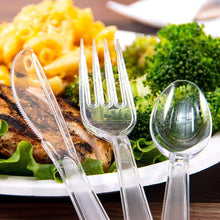 Clear crystal-style forks, spoons, and knife utensils on table
