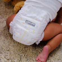 Kirkland Signature diapers, white with light yellow moon and star print, folded