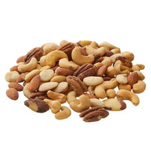 Salted mixed nuts pile with cashews and almonds in varied sizes