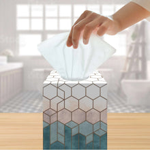 Facial tissue box with tissue being pulled from top opening
