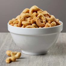 Whole cashews in a white bowl