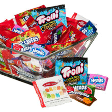 Assorted candy variety pack in clear tray with wrapped sweets, including Nerds and Trolli