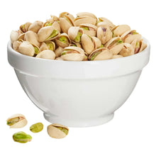 Bowl of unsalted in-shell pistachios with cream shells and green kernels