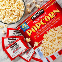 Microwave movie theater popcorn boxes with bowl of popped corn