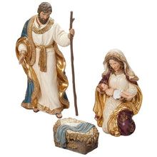 Nativity figurines: standing Joseph holding staff and Mary holding baby