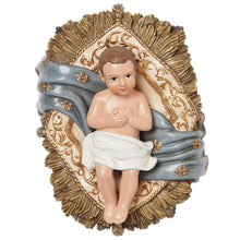 Baby Jesus nativity figurine in a manger with gold-trimmed halo