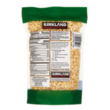 Organic pine nuts pouch back with Nutrition Facts and barcode, filled with pine nuts