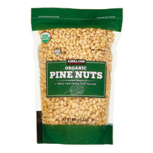 Organic pine nuts package with green label and visible pine nuts in clear pouch
