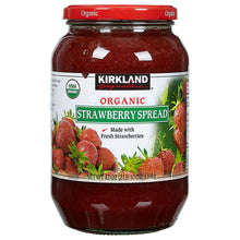 Organic strawberry spread jar with red lid and strawberry fruit label