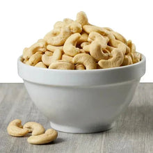 Whole cashews in a white bowl